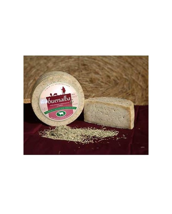 Whole Manchego cheese with rosemary